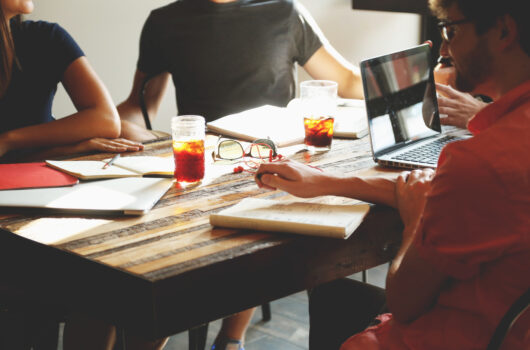 Four people talking While working